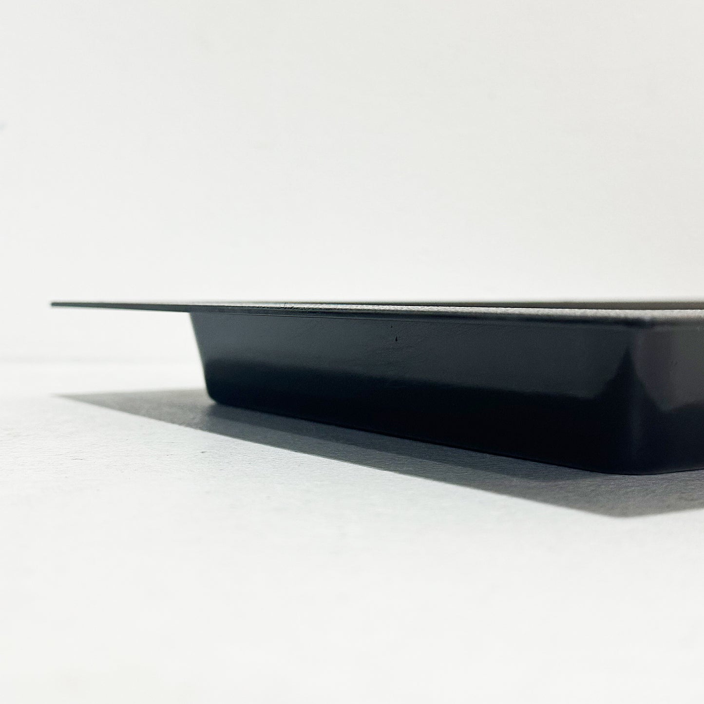 Side view of black recessed vent cover