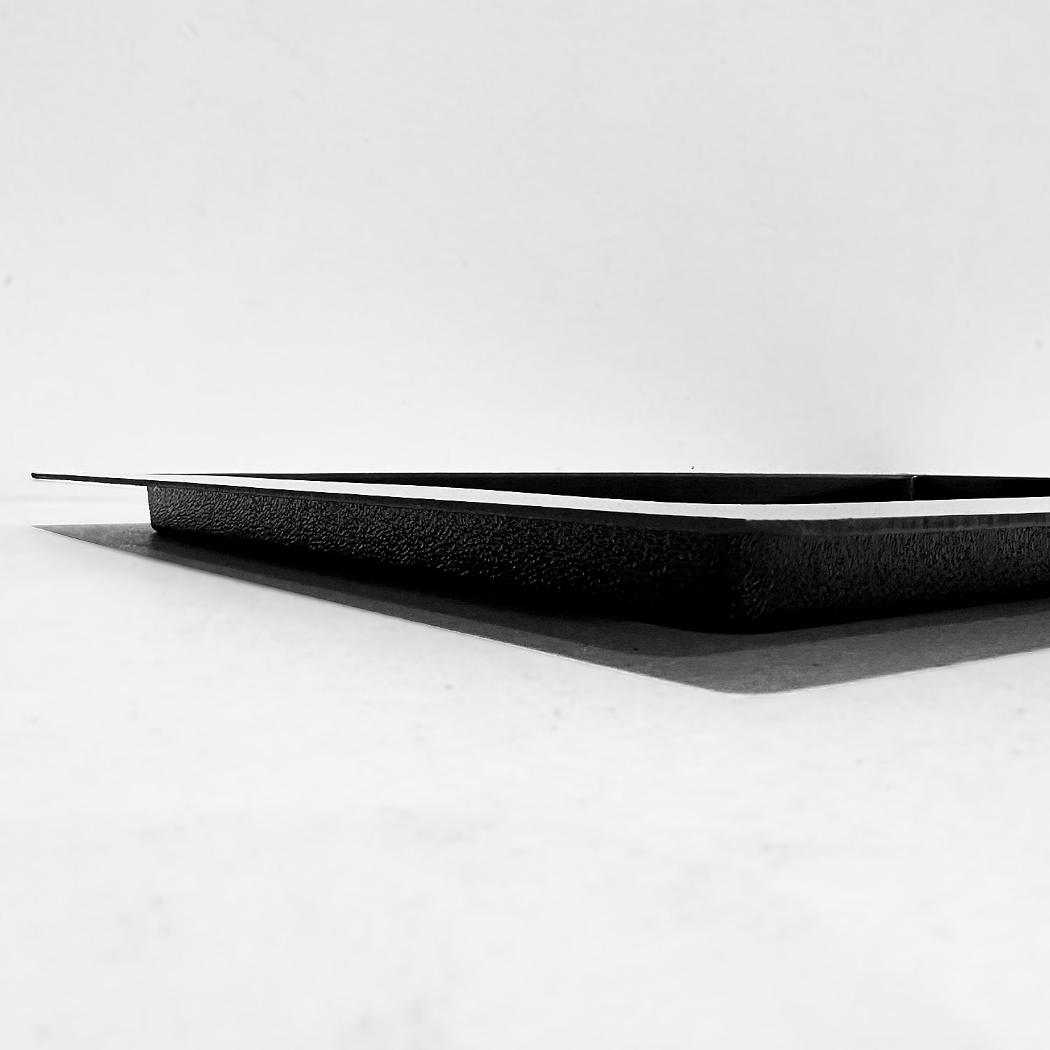 Side view of large outward mounted vent cover (black)