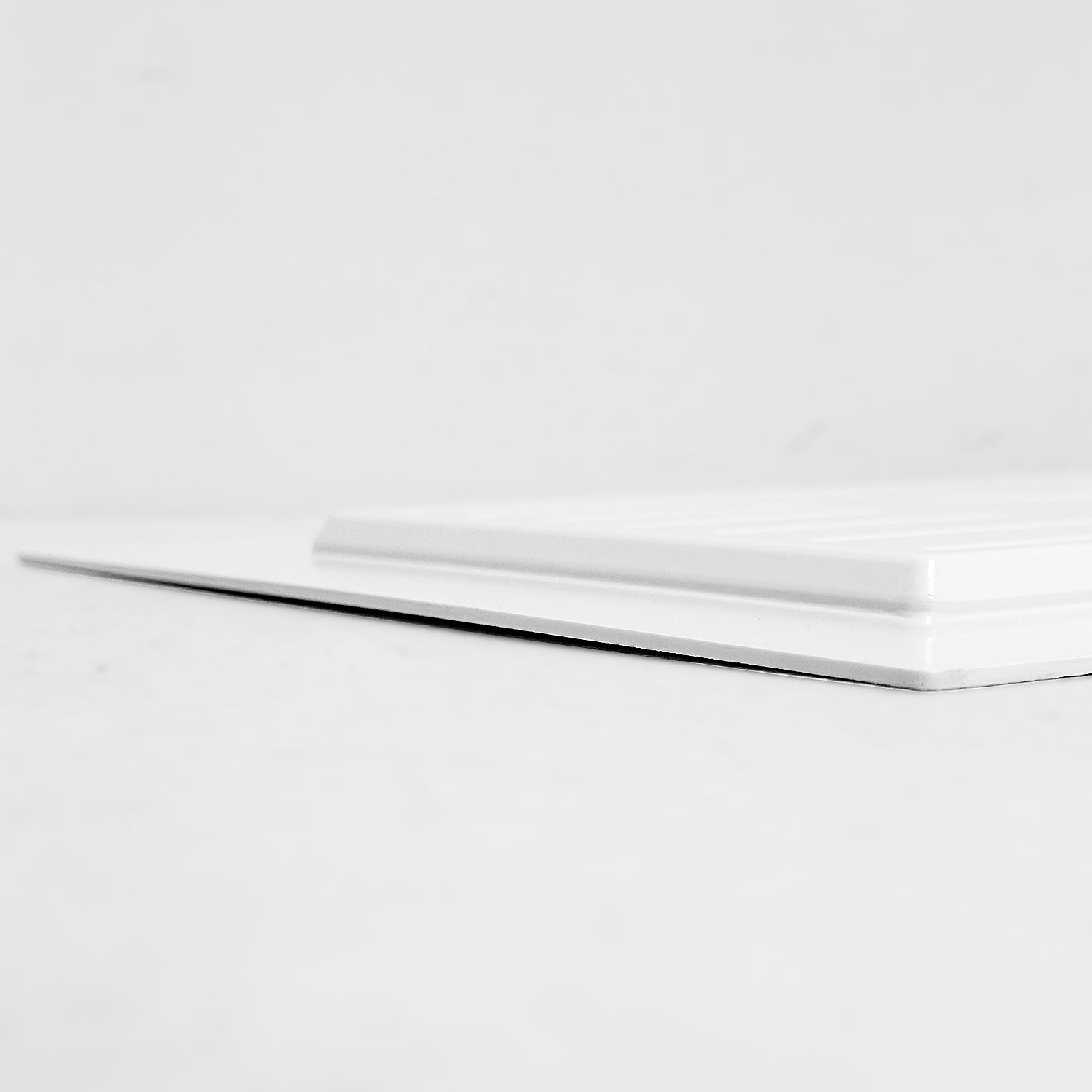 Side view of white shallow depth vent cover