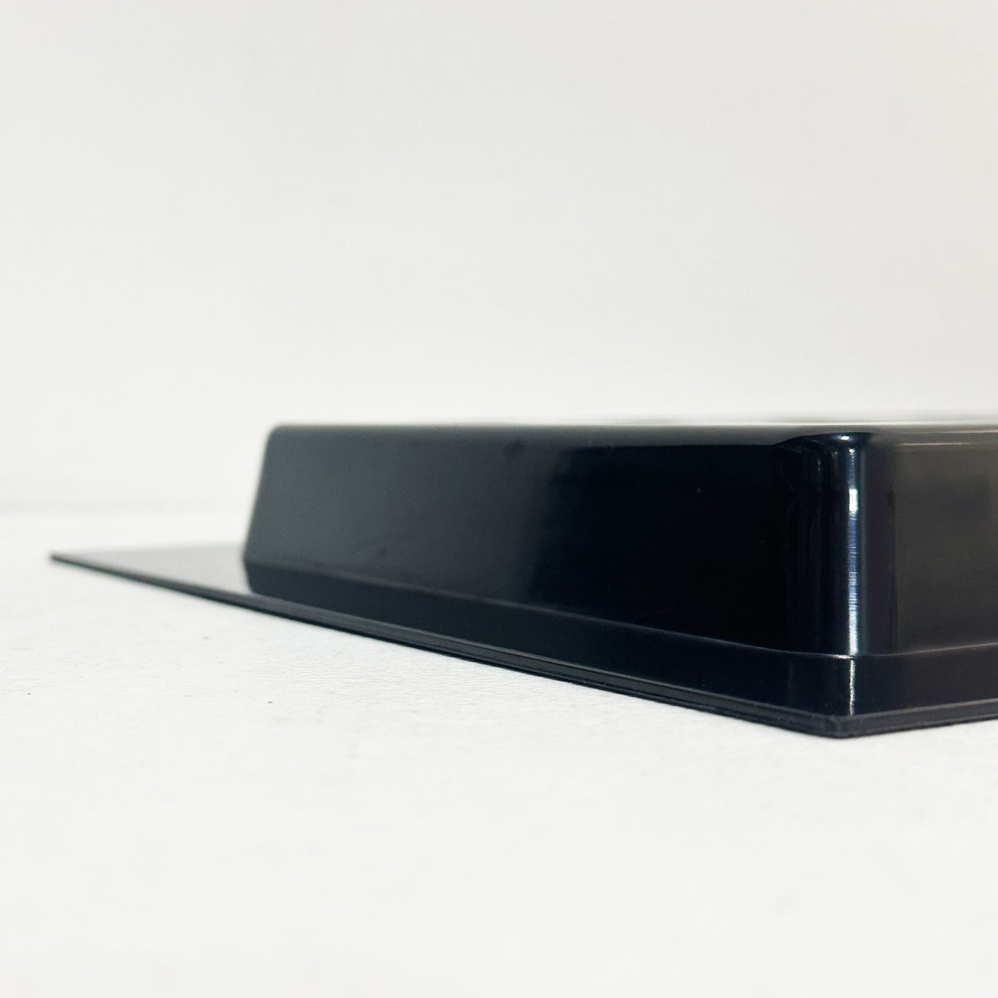 Side view of black recessed vent cover