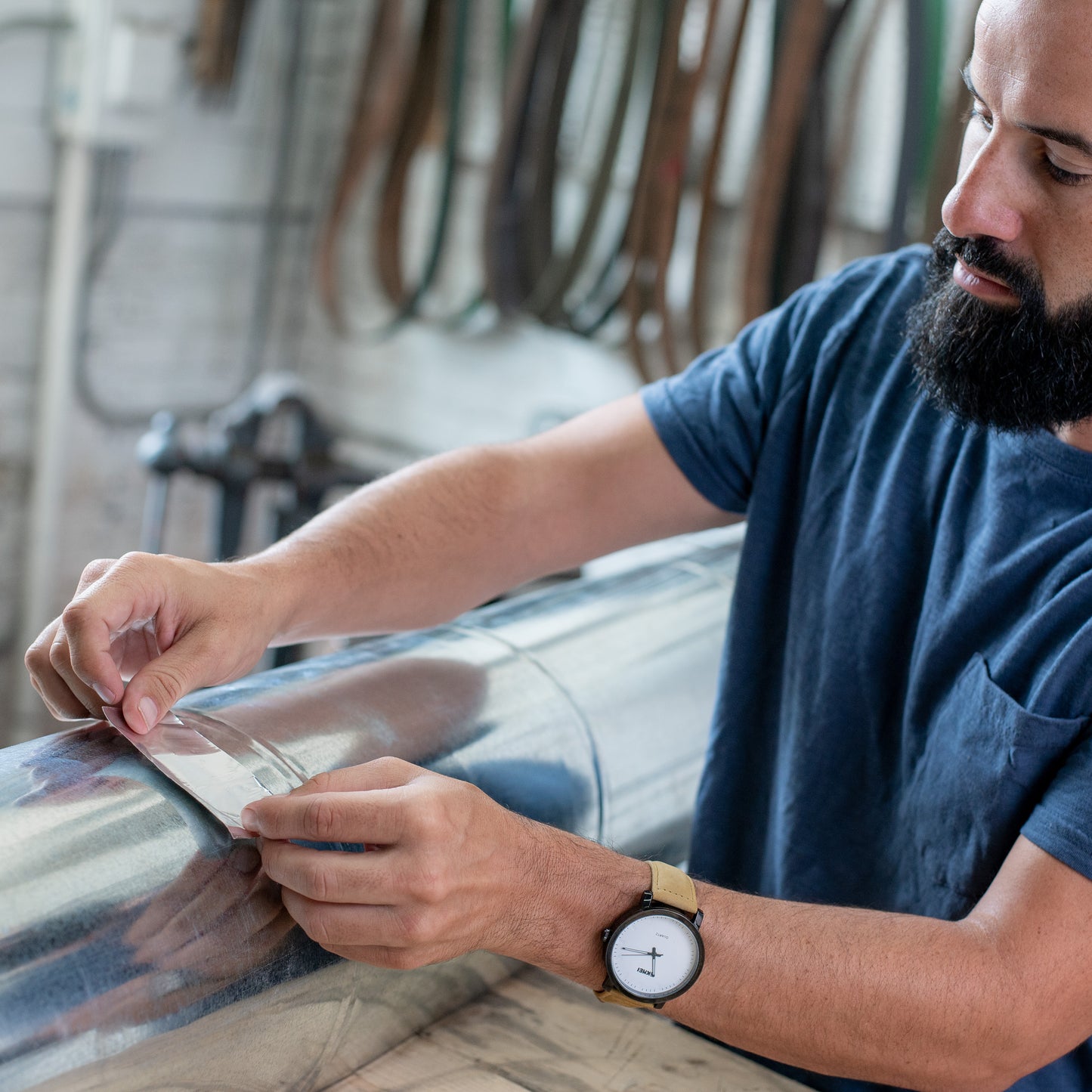 Applying aluminum foil adhesive to duct