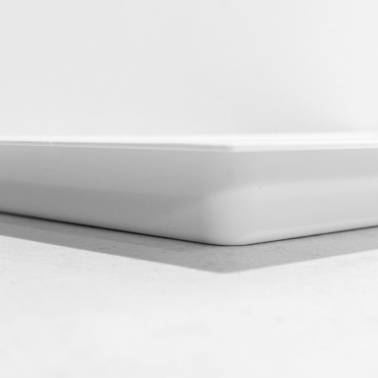 Side view of white recessed vent cover